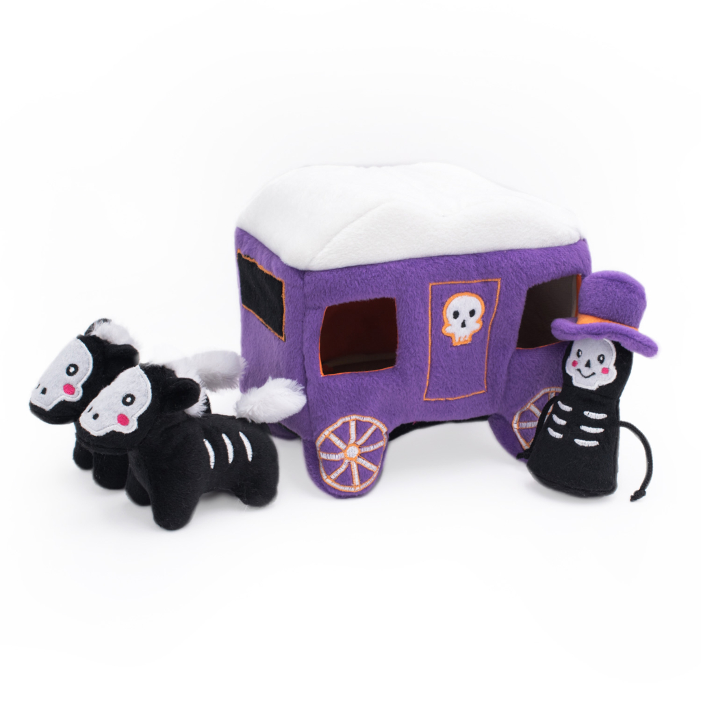 A Halloween Burrow® - Haunted Carriage, accompanied by two plush horses and a plush skeleton figure wearing a purple hat.