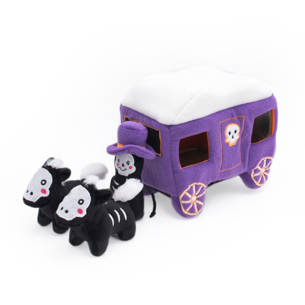 Halloween Burrow® - Haunted Carriage of a purple carriage with a white roof, decorated with a skull design, and pulled by three small black skeleton horses with a figure wearing a purple hat sitting on the front.