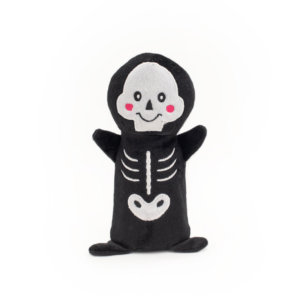 A Halloween Colossal Buddie - Witch resembling a smiling skeleton with pink cheeks, black body, white facial features, and bones depicted on its body.