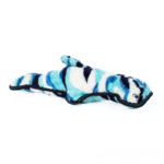 A stuffed toy shaped like a whale with a blue and white camouflage pattern and black stitching details.