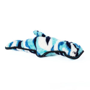 A stuffed toy shaped like a whale with a blue and white camouflage pattern and black stitching details.