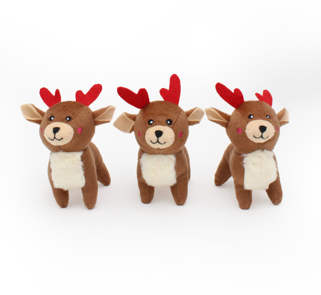 Three Holiday Miniz 3-Pack Reindeer with red antlers and white bellies are standing in a row against a plain white background.