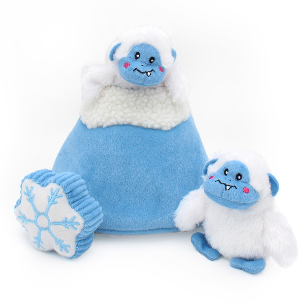 Three Holiday Burrow® - Yeti Mountain: a blue bell-shaped toy with a white top, a white and blue yeti, and a blue snowflake.