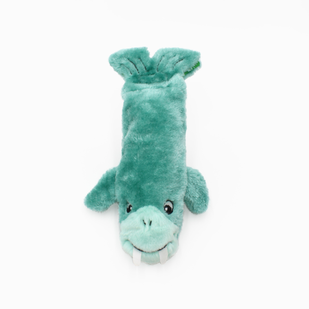 A plush toy resembling a blue-green walrus with flippers and tusks, displayed on a white background.