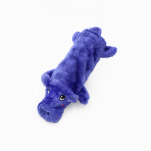 A plush toy in the shape of a blue hippopotamus, lying on a white background.