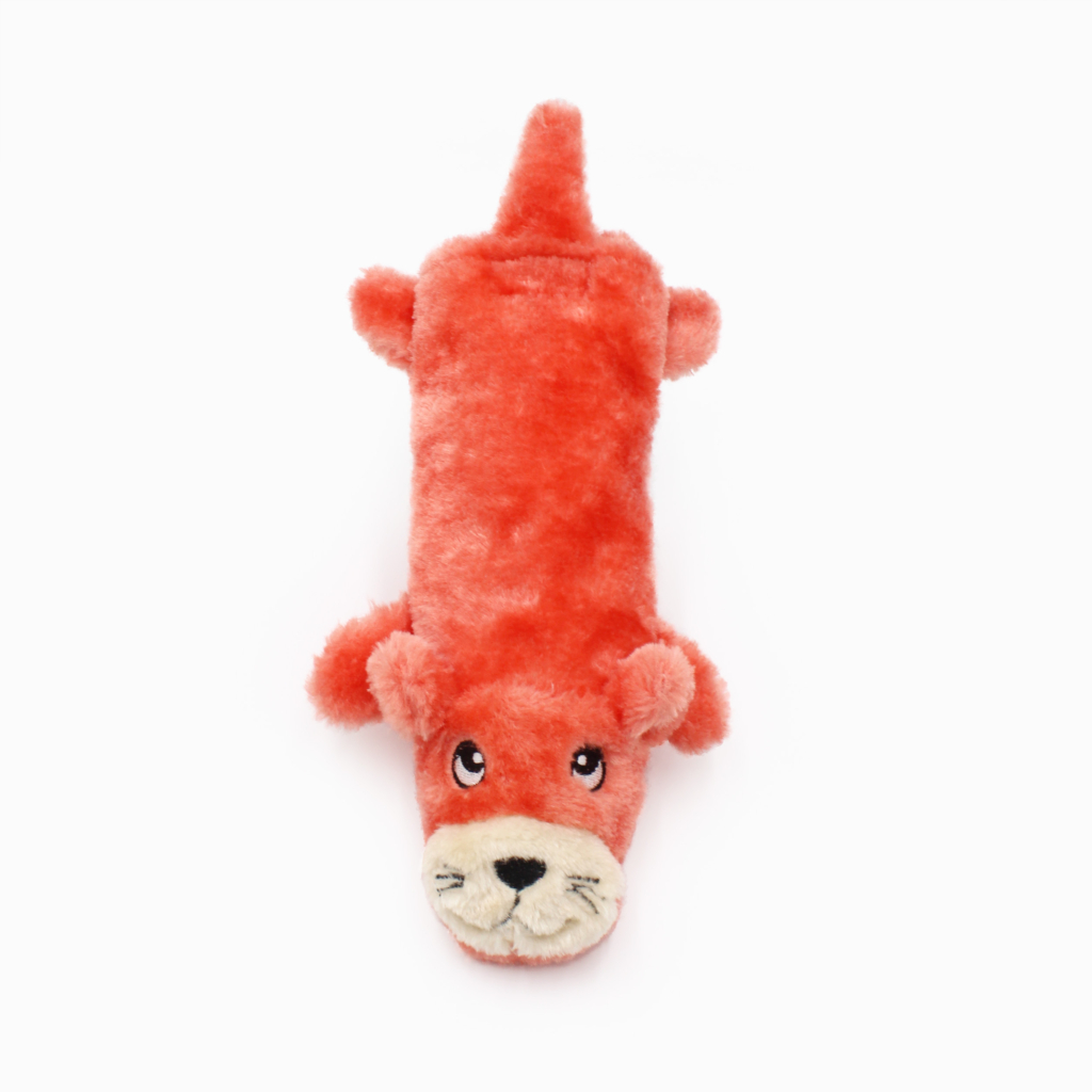 A plush toy in the shape of a reddish-orange otter with embroidered facial features, seen from above on a plain white background.