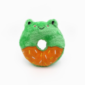 Plush toy shaped like a green frog with a happy face, resembling a donut. The bottom half is orange with colorful sprinkles.