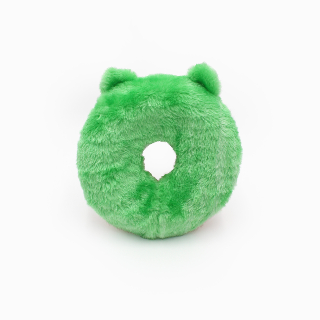 A green, fluffy, donut-shaped object with two small ear-like protrusions at the top.