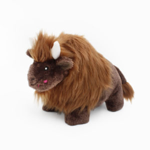 A plush toy resembling a bison with brown fur, small white horns, and pink blush marks on its cheeks.