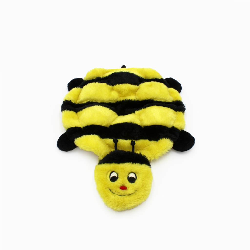 A plush toy resembling a bee with yellow and black stripes, round eyes, and a smiling face.