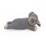 A grey, stuffed Snooziez with Shhhqueaker - Elephant lies on its side. The toy features a ribbed texture, pink feet, and grey fuzzy ears.