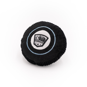 A circular black plush toy with a white and black embroidered logo featuring a soccer ball and the text "SportsBallz - Hockey Puck.