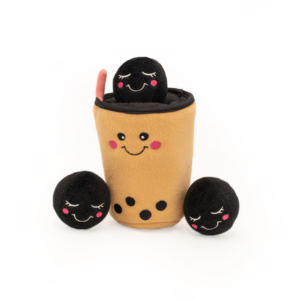 A Zippy Burrow® - Boba Milk Tea featuring a smiling cup with a straw and three black, round, smiling plush balls arranged around it.