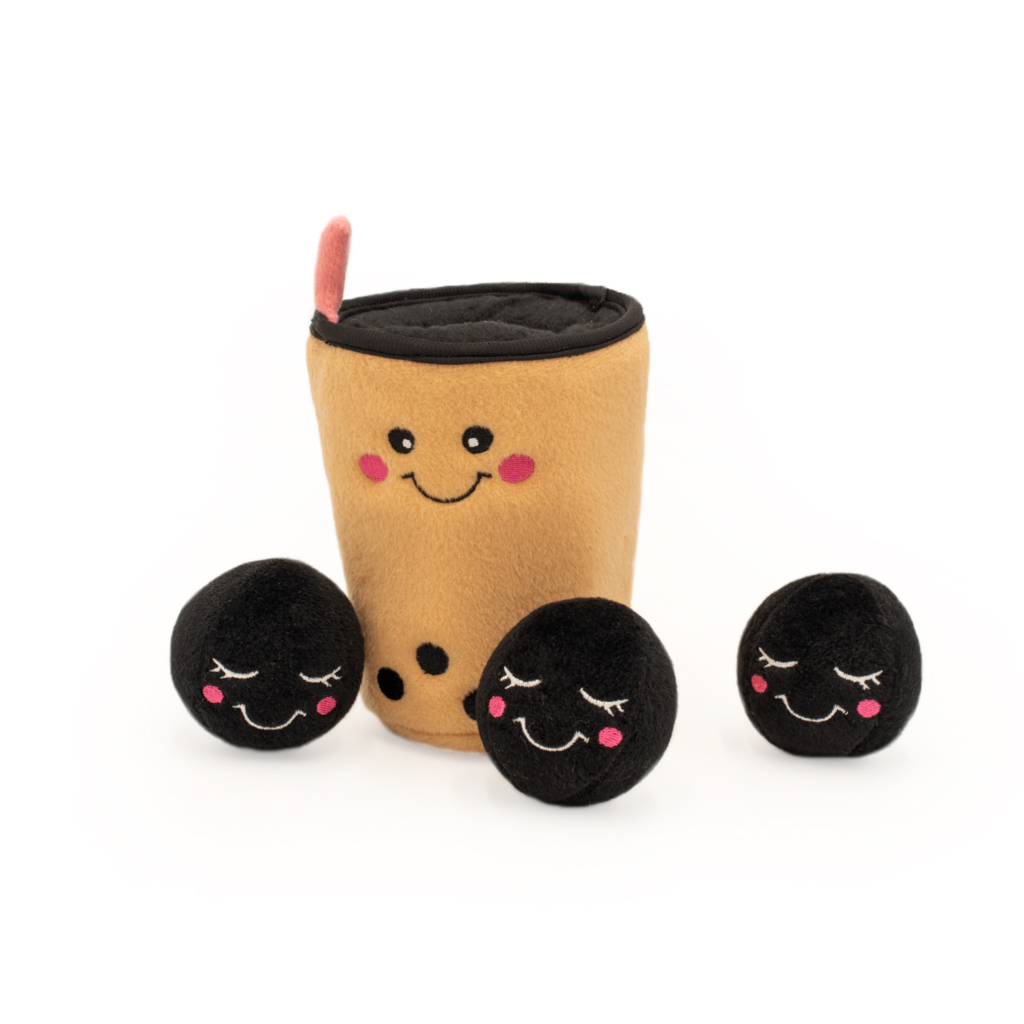 Zippy Burrow® - Boba Milk Tea in the shape of a bubble tea cup with a happy face, accompanied by three small black plush balls with smiling faces.