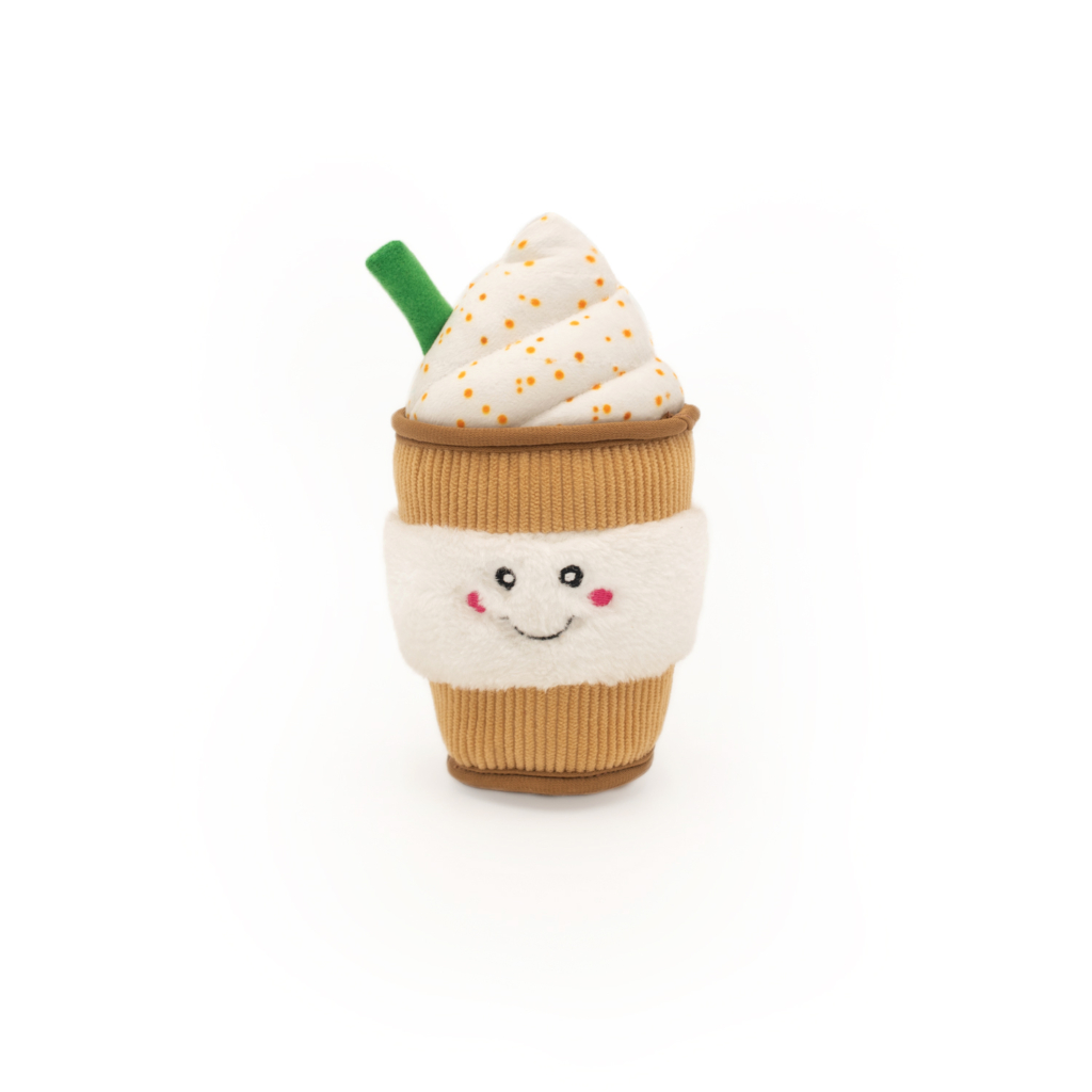 A NomNomz® - Puppuccino resembling a cup of coffee or hot cocoa with whipped cream topping, featuring a smiling face on the cup.