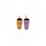 Two ZippyClaws® NomNomz® - Milk Tea and Taro, one brown and one purple, with smiling faces and pink straw tips, set against a plain white background.