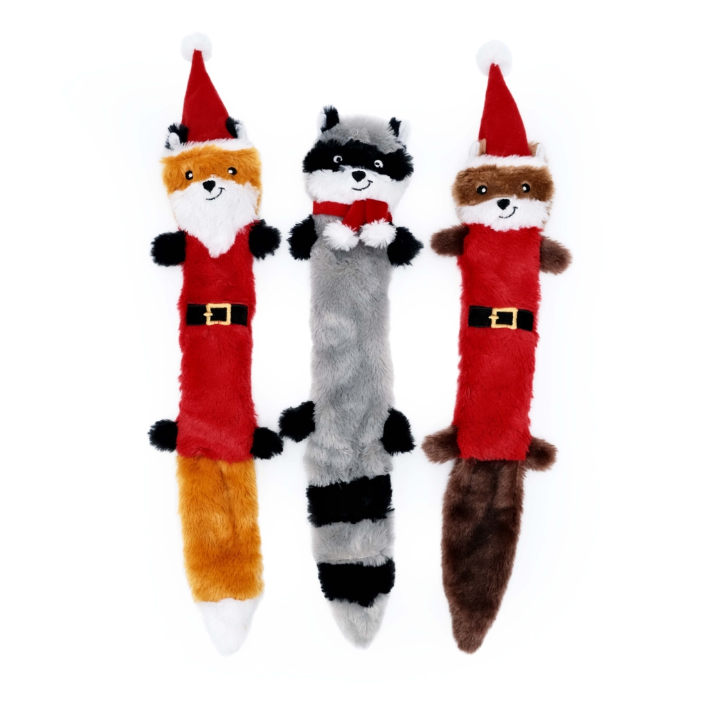 Three long toys resembling a fox, raccoon, and beaver, all dressed in Santa Claus outfits, arranged side by side have leaves replaced. 
with: 

Holiday Skinny Peltz 3-Pack - Large (Santa Fox, Raccoon, and Elf Squirrel).