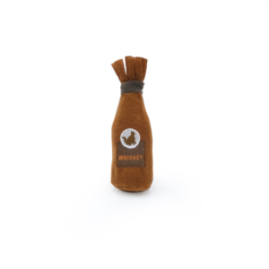 A plush toy designed to resemble a whiskey bottle, with the word "WHISKEY" and a silhouette of an animal on the label. The toy is primarily brown with a darker top portion. ZippyClaws® Catnip Crusherz - Whiskey