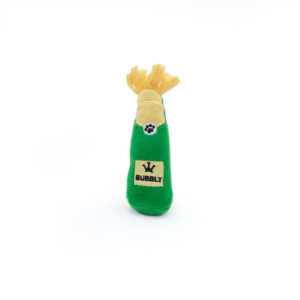 A green dog toy shaped like a champagne bottle with a label reading "BUBBLY" and a paw print logo. The top is made to look like golden champagne foil, called ZippyClaws® Catnip Crusherz - Bubbly.