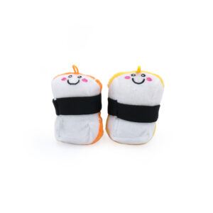 Two **ZippyClaws® NomNomz® - Sushi** keychains designed to resemble cute sushi with smiling faces. Each toy is wrapped in a black band with the left one featuring an orange accent and the right one featuring a yellow accent. They both have small hooks on top for attaching keys.