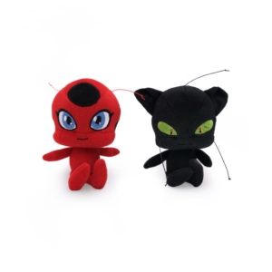 Two Miraculous Kwami's 2-Pack - Tikki and Plagg on a white background: one is red with blue eyes and black antennae, the other is black with green eyes and green antennae.