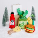 Display of food related dog toys. Jar of pickles Hamburger, Corn and tamale