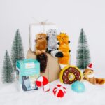 Display of dog toys in front of snowy back drop