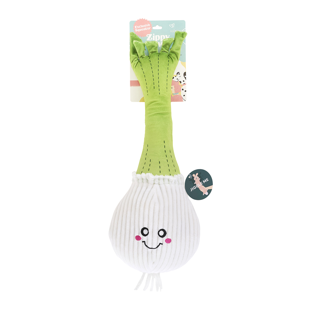 Plush dog toy named Jigglerz® - Rocket Pop, shaped like a smiling green onion with a white textured bulb, stitched green leaves, and an attached product tag.