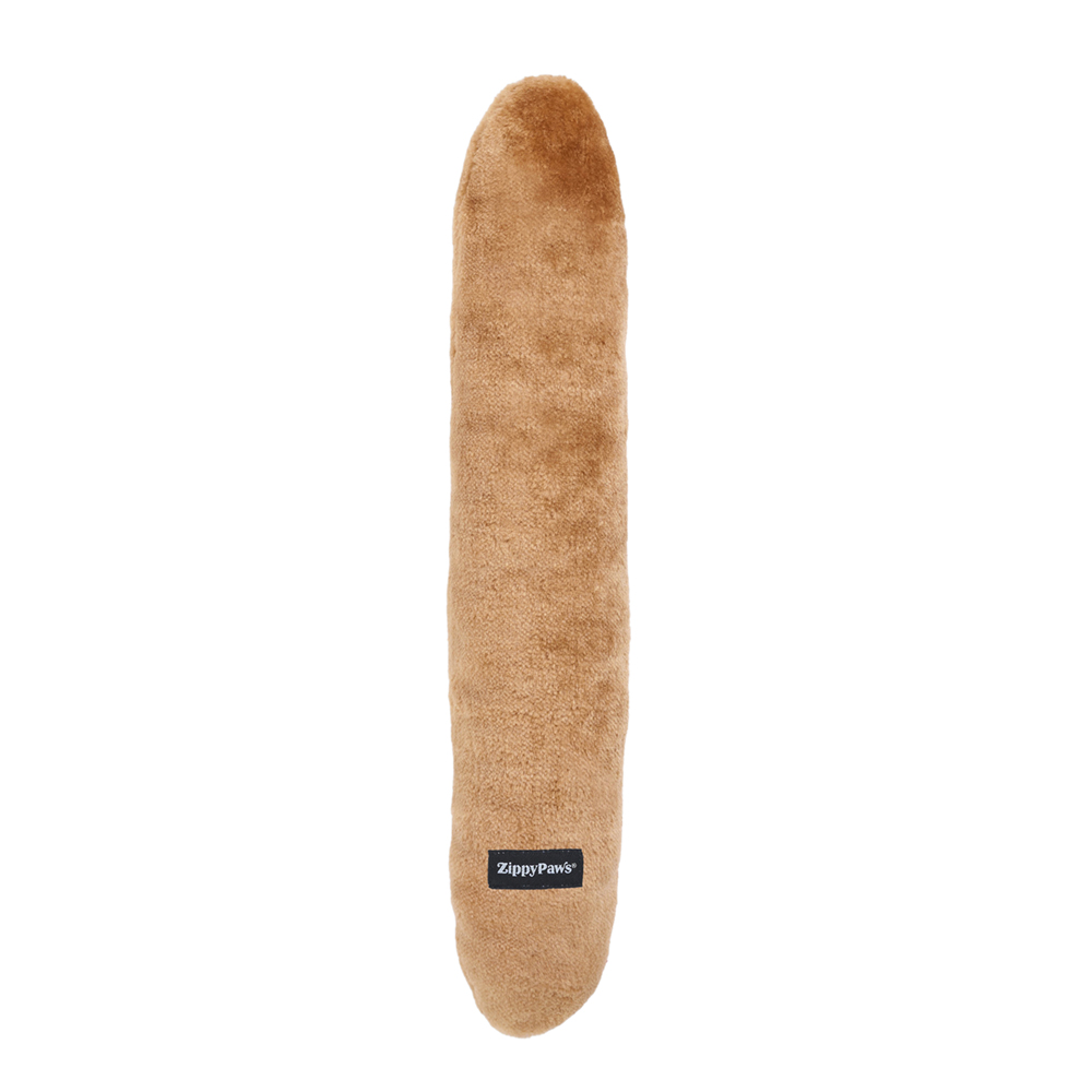 A long, light brown Jigglerz® - Corn Dog plush dog toy with a soft texture, featuring a small black "ZippyPaws" label near one end, shown against a white background.