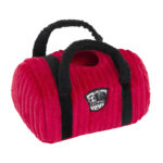 Red and black plush duffel bag-shaped dog toy with handles and a soccer-themed patch labeled “Zippy Burrow® - Zippy Meal” on the side.