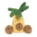 Zippy Burrow® - Zippy Meal features a plush pineapple toy with green leaves on top and three round, brown plush pieces at the base, each adorned with small black facial features.