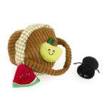 The Zippy Burrow® - Zippy Meal features a plush picnic basket with a handle, a stuffed green apple, a plush watermelon slice, and a small black plush ant.
