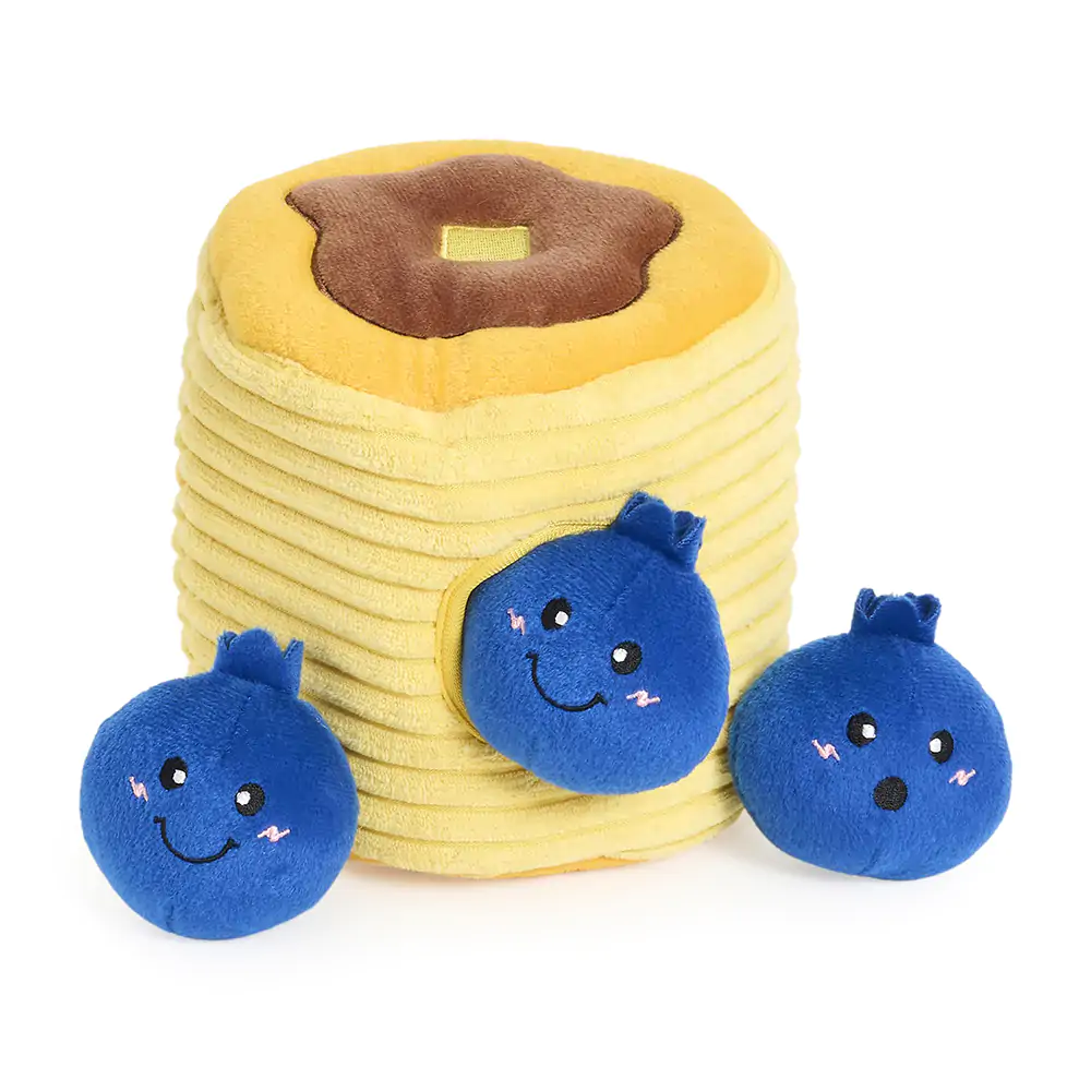 Enjoy the Zippy Burrow® - Zippy Meal: a plush stack of pancakes topped with a soft pat of butter, paired with three smiling blue plush blueberries.