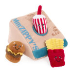 The Zippy Burrow® - Zippy Meal is a plush toy set designed like a takeout box, featuring a smiling plush hamburger, fries, and drink—all with cheerful faces and vibrant colors.