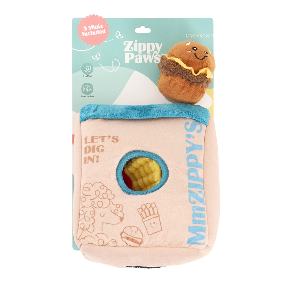 A Zippy Burrow® - Zippy Meal plush dog toy set featuring a soft pink bag with blue trim and two small plush food toys, including a smiling burger and a yellow figure, partially visible inside the bag.