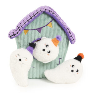 A plush, mint-green house with a purple roof and bunting, surrounded by three small, white plush ghosts wearing party hats.