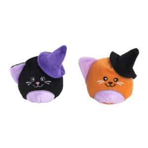Two round cat plush toys, one black with a purple witch hat and one orange with a black witch hat.