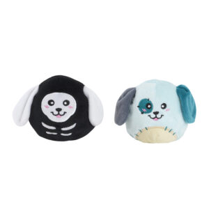Two spherical plush toys: one black and white with a skeleton pattern, and one light blue with a patch over its eye.